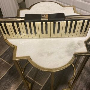 - Kate Spade piano key clutch
